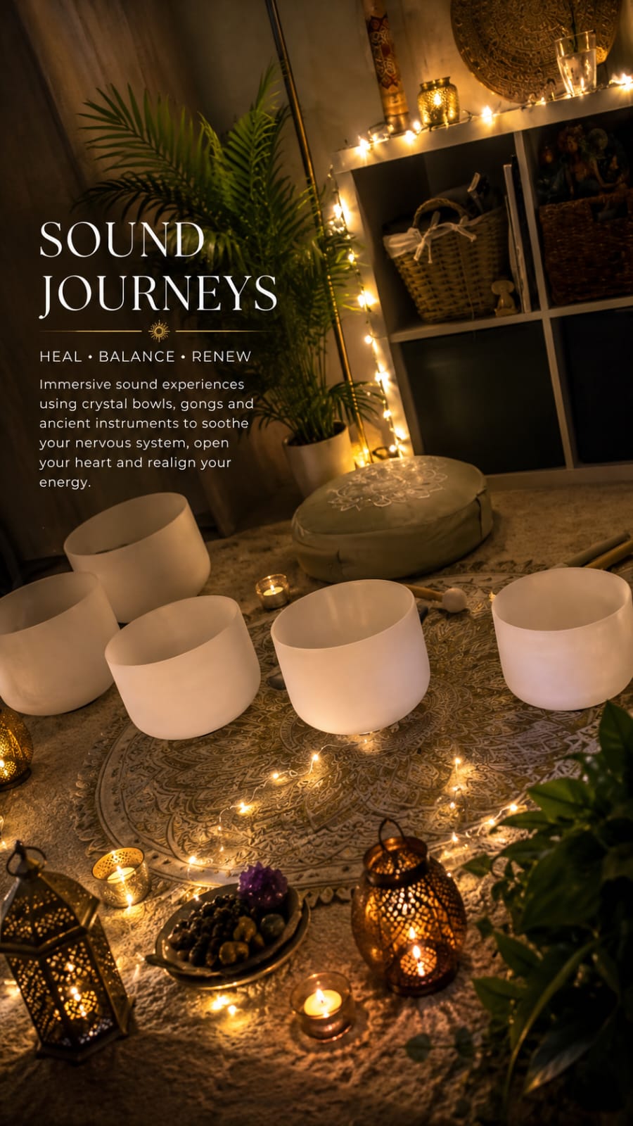 Crystal singing bowls, lanterns and candlelight arranged for a sound journey